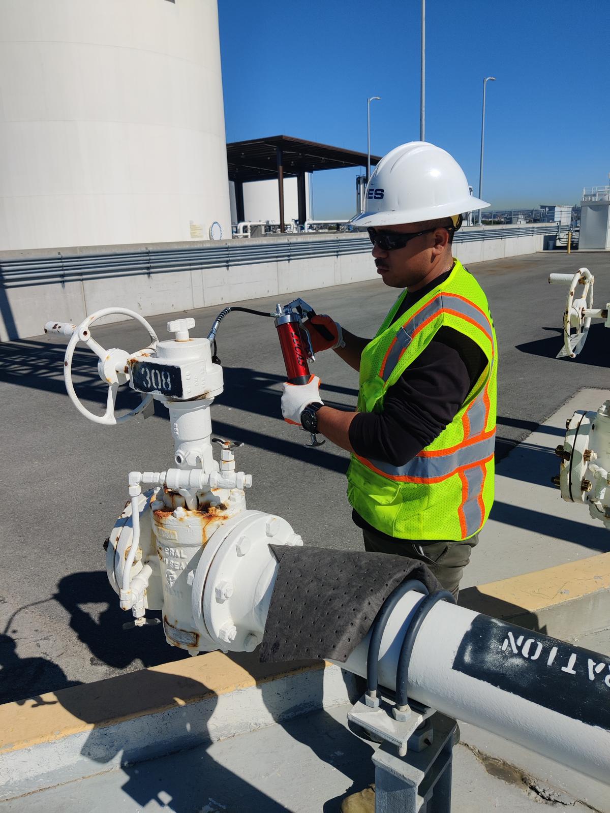 Technician inspecting fuel gauges